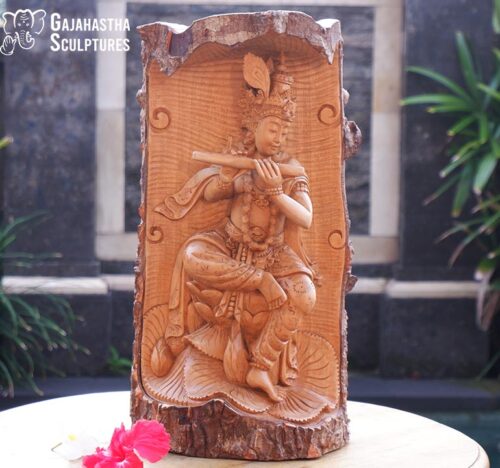 Lord krishna playing flute statue